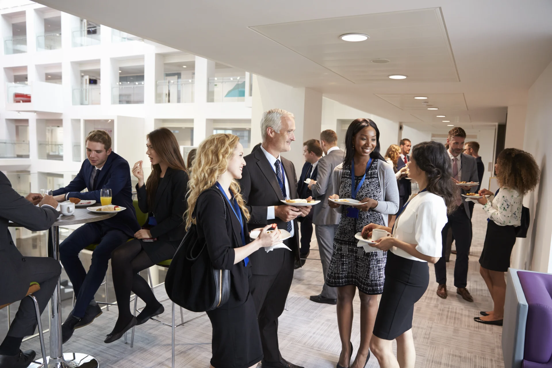 Delegates networking during conference lunch break